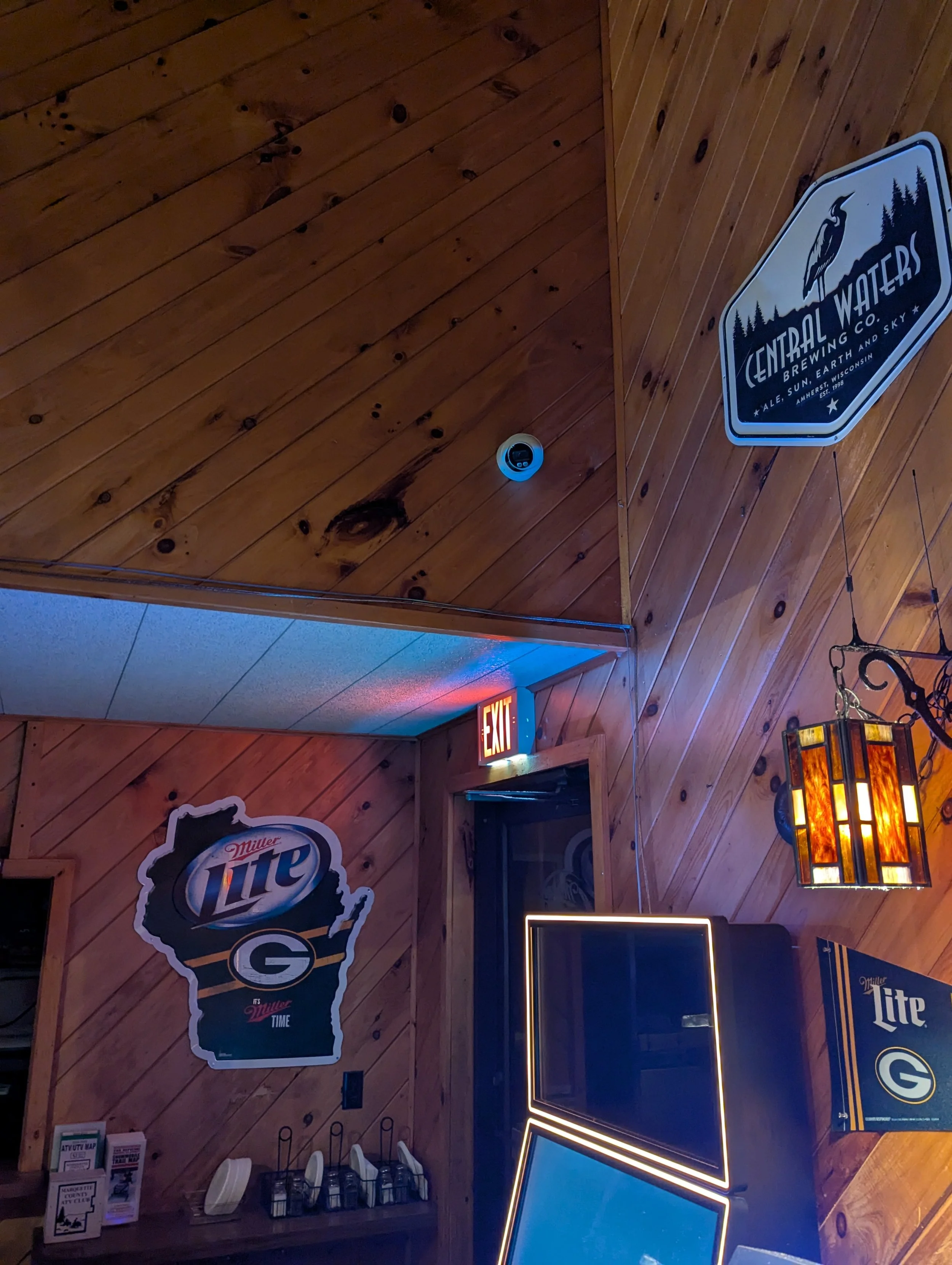 Indoor security camera installed in bar with wide coverage of seating area