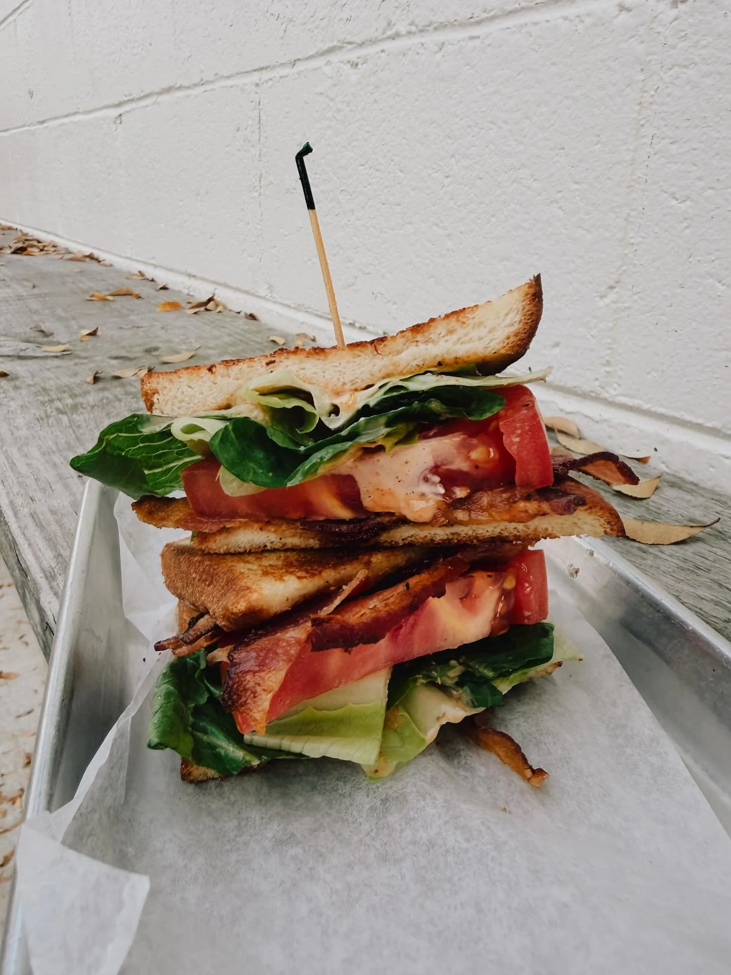 B L T season forever

Crispy bacon, thick cut juicy tomato, crunchy lettuce, our house made garlic aioli, on grilled white bread. Simple on purpose and somehow still magic.

One of those sandwiches you forget about until you take a bite and remember 