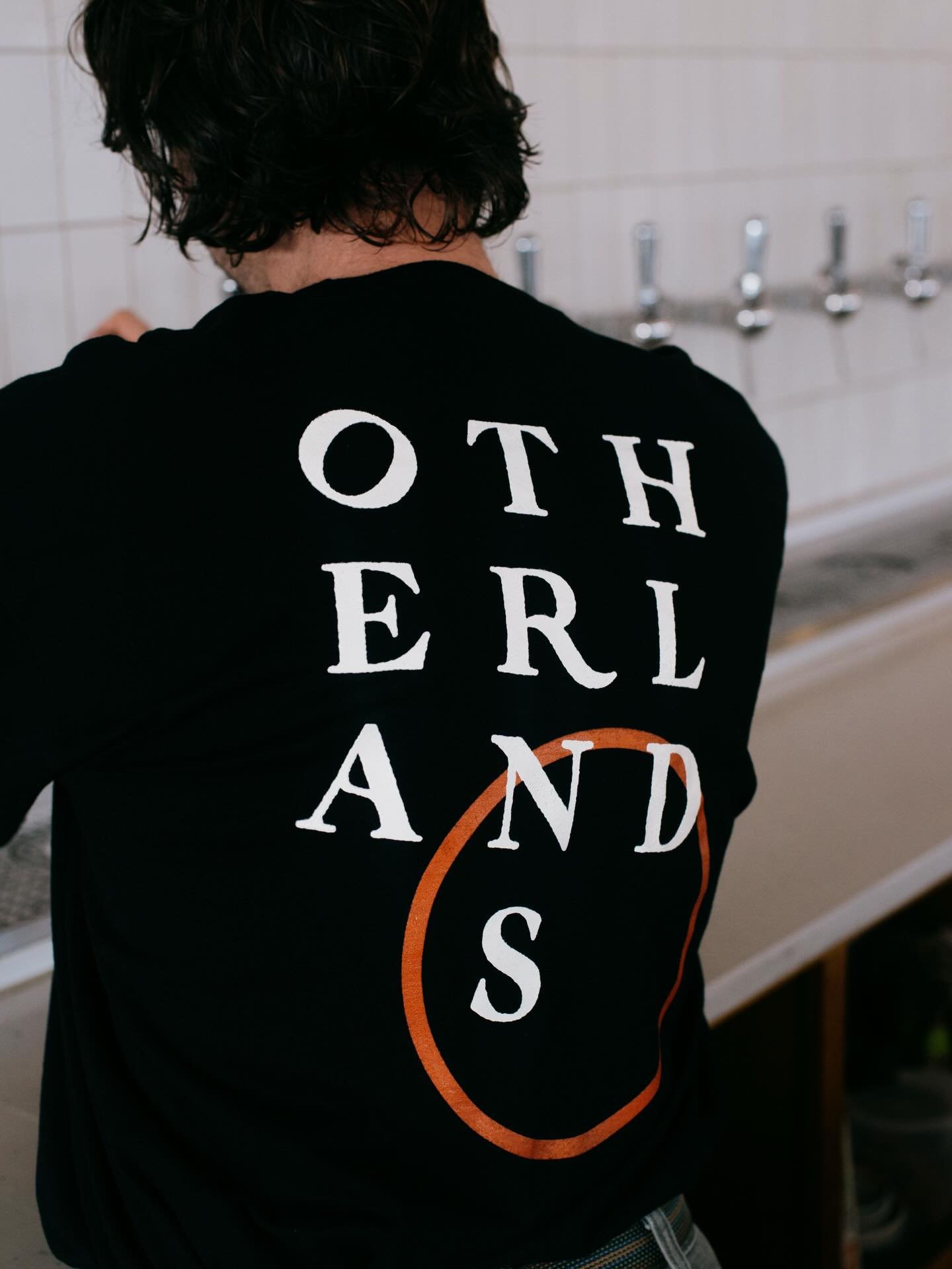 New merch 👀 👀 

Black heavy weight Tultex long sleeve with terra compass mark on front left and back is other lands mixed lettering with terra ring ☀️ 

Green eco Hanes Crewneck with other lands mixed fonts on back and original other lands with sun