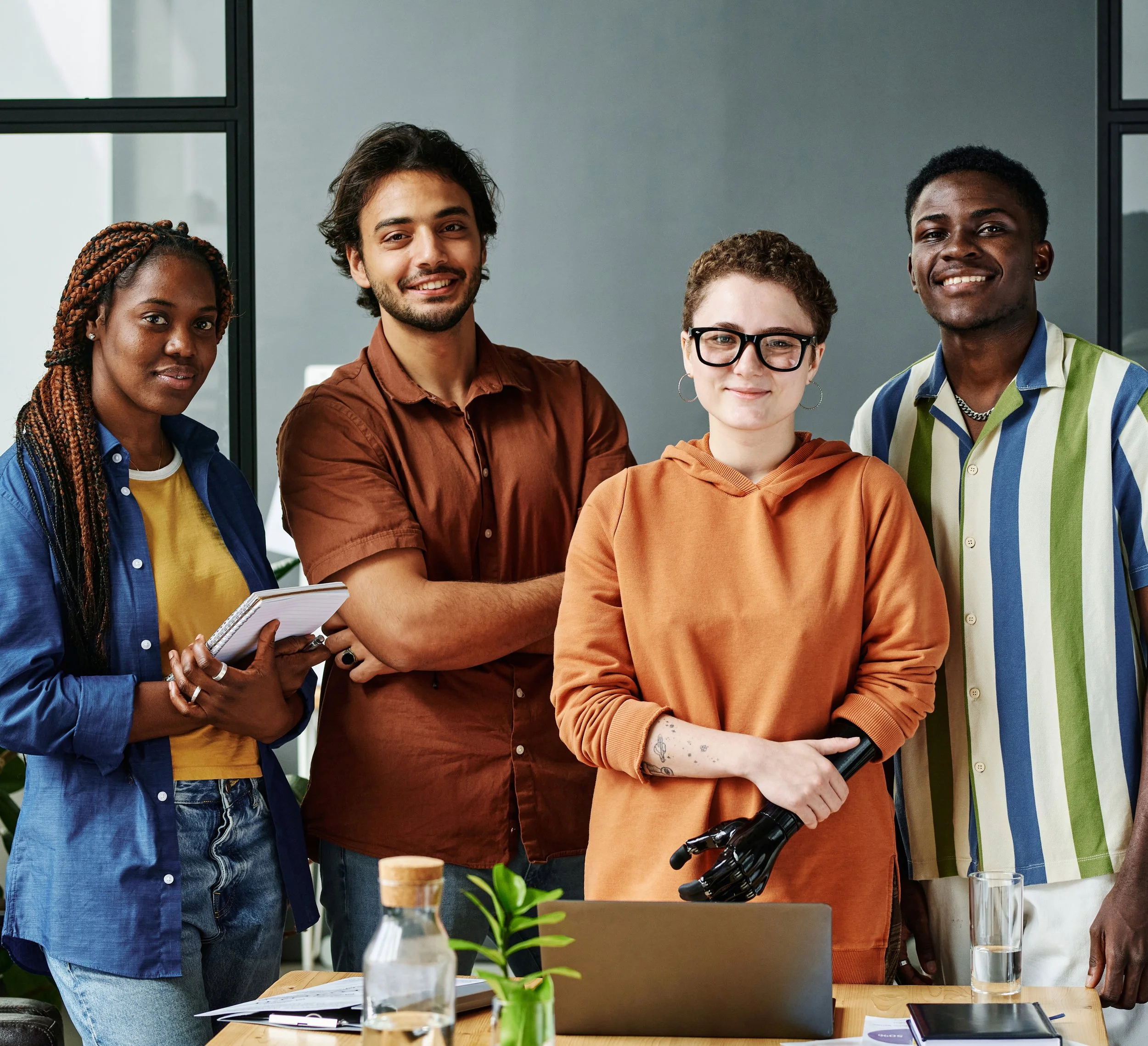 A group of four multi-ethnic, disability group.