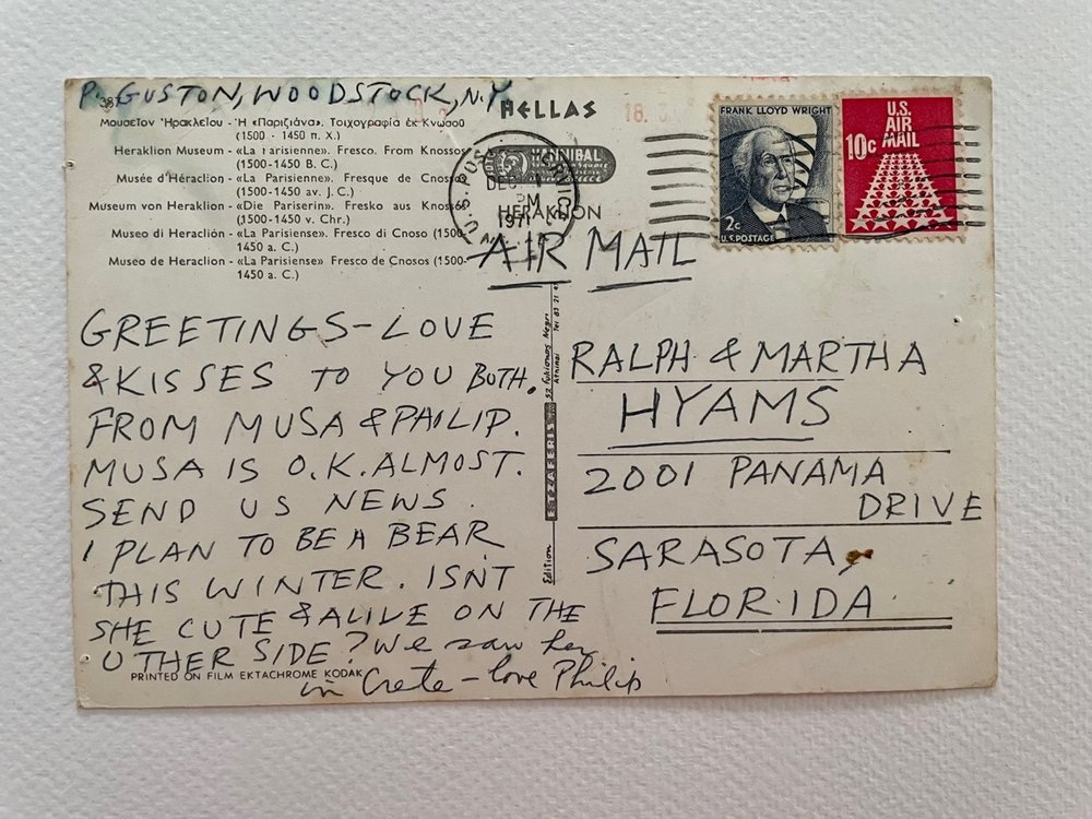  POSTCARD  Postmark: Dec 1971, hard to make out place, but mailed by USPS)  AIR MAIL  Return address: G. GUSTON, WOODSTOCK, N.Y.  GREETINGS — LOVE &amp; KISSES TO YOU BOTH. FROM MUSA &amp; PHILIP. MUSA IS O.K. ALMOST. SEND US NEWS. I PLAN TO BE A BEA