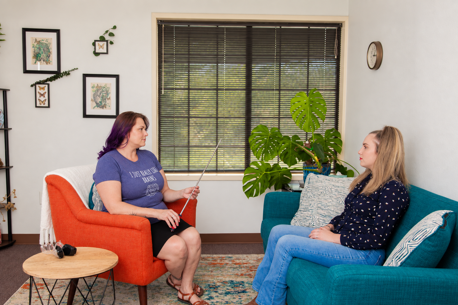Stephanie Henderson demonstrating Brainspotting with a seated participant in the Whole Heart Brainspotting office.