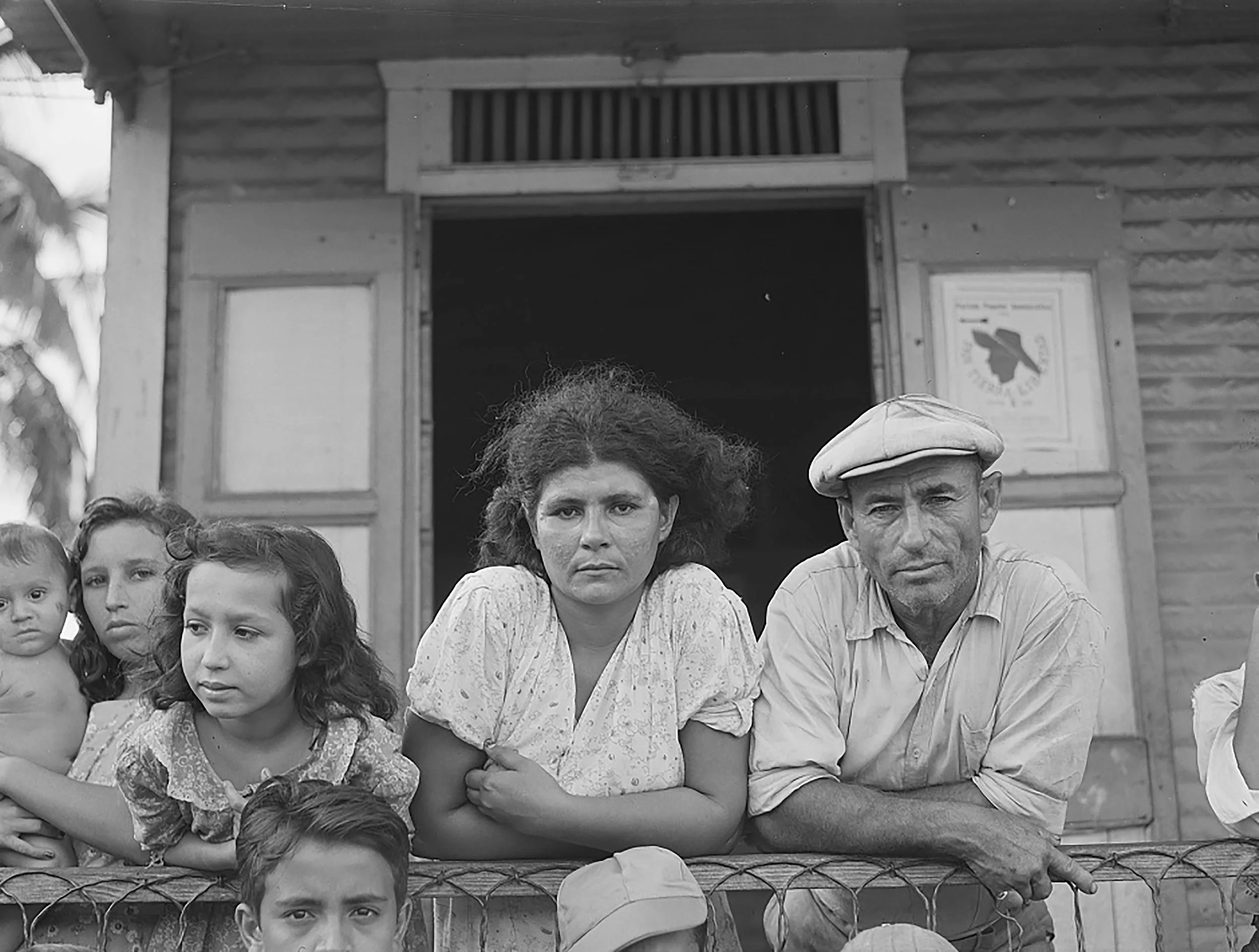 Black and white photograph dated 1941 by Jack Delano of people on the street in Bayamon, Puerto Rico.