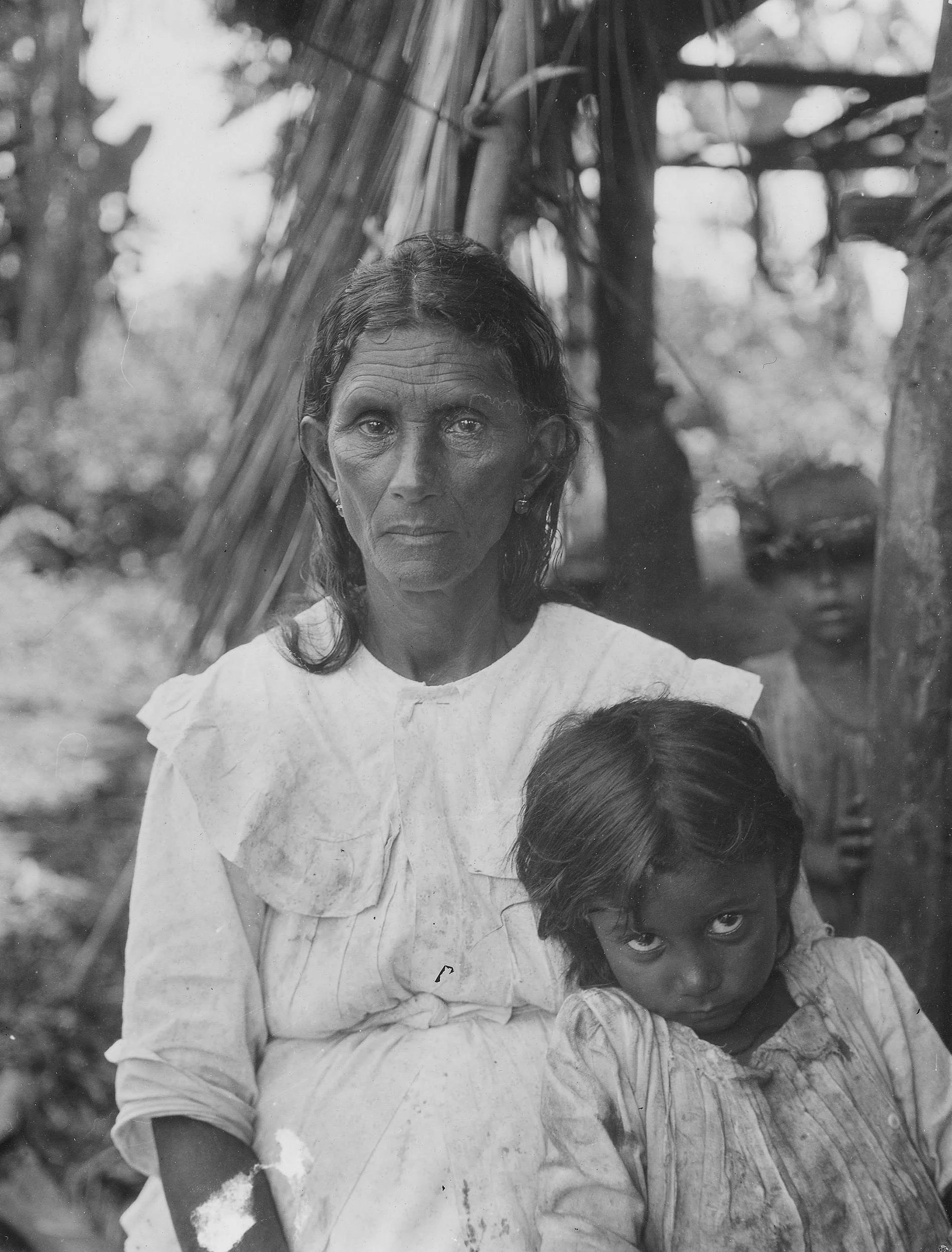 Historic black and white photograph circa 1919 of native woman and child in Baracoa, Cuba.