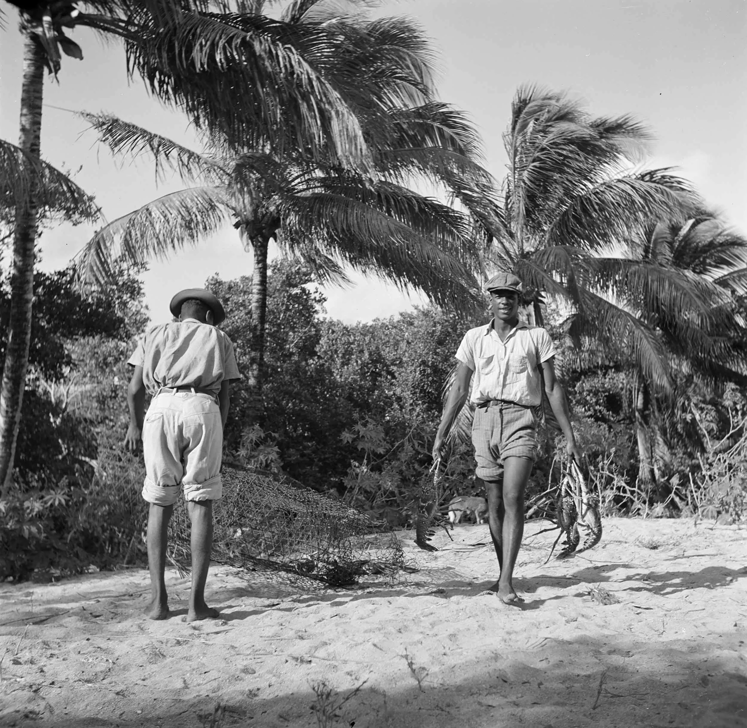Black and white photograph dated 1947 by Willem van de Poll of kreeftenvissers in Simpson Bay Lagoon op Sint-Maarten.