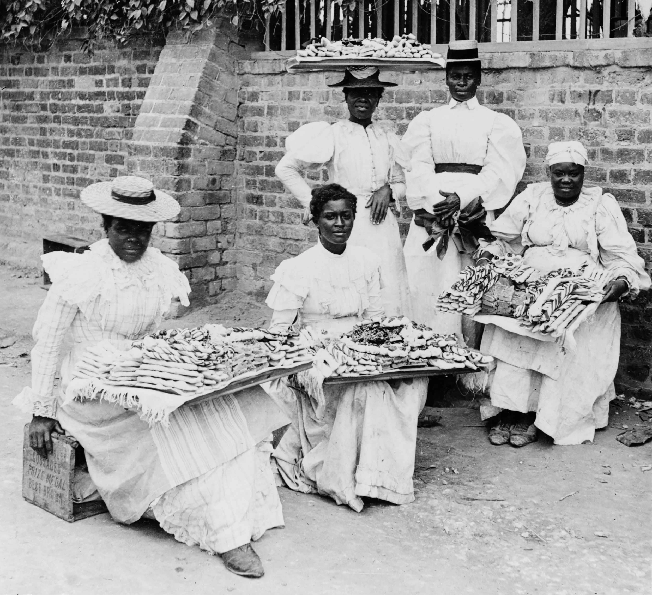 Historic photograph circa 1899 of dessert sellers in Kingston, Jamaica.