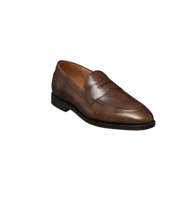 Brown leather men's dress shoe with a rounded toe and black sole.
