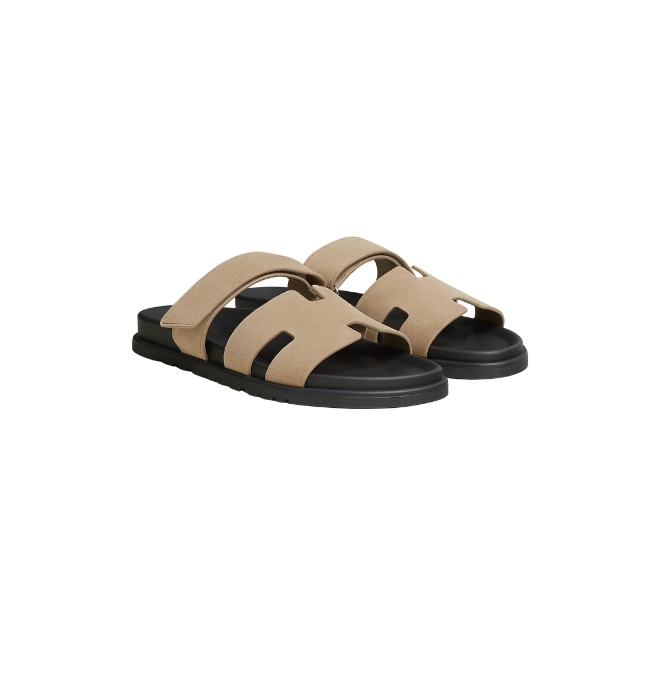 Beige and black slide sandals with adjustable straps