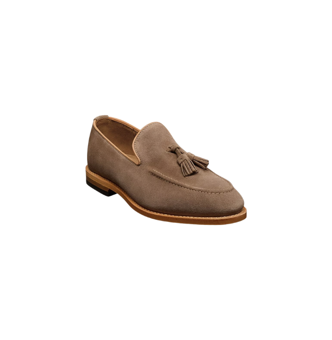 Beige suede tassel loafer on a white background