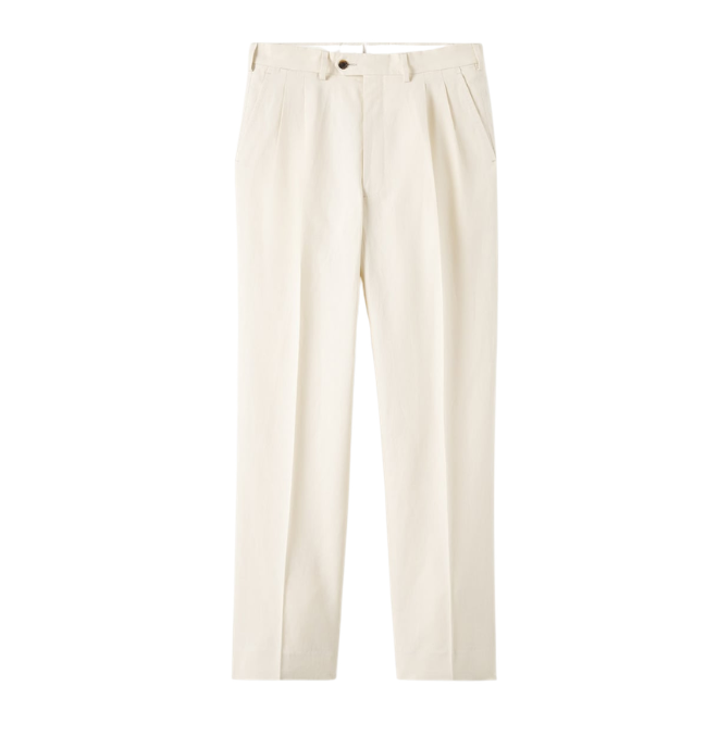 Cream-colored tailored trousers with pleats, a button, and a zipper.