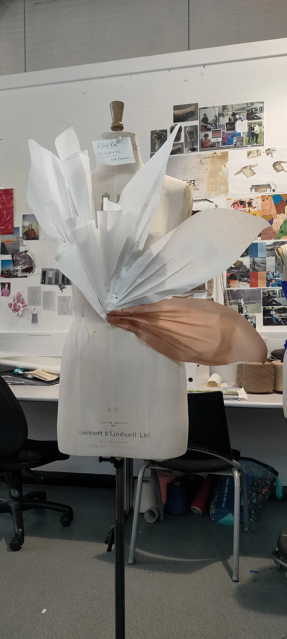 Early structural exploration on a mannequin shows Rai’s process as both hands-on and conceptual.