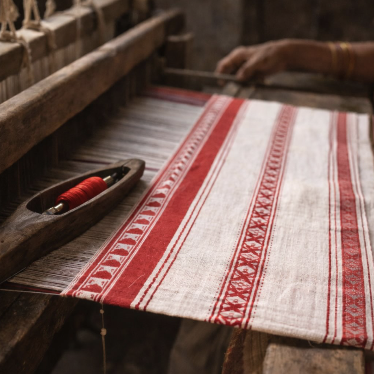 A handloom textile showcasing traditional striped patterns and natural dyeing techniques. Photo credit: @fltkhadi