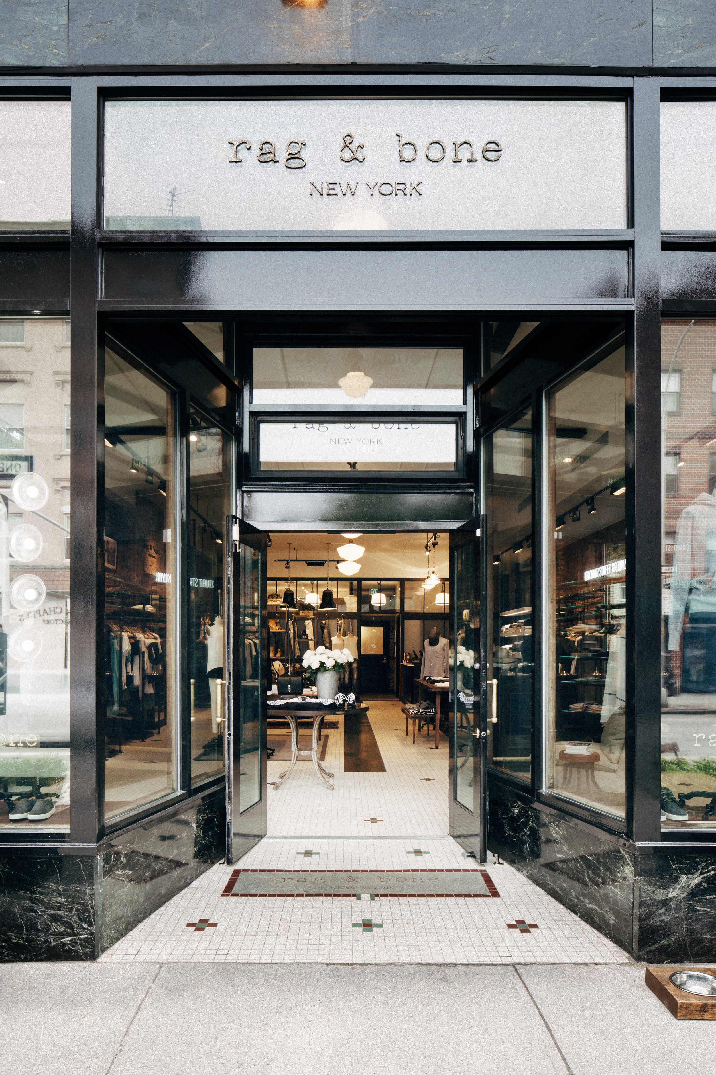 BLD commercial retail adaptive reuse in Brooklyn, New York includes remnets of the former bar, transparent entry creating a welcoming transition from the street, thoughtful zoning for apparel, accessories, and fitting areas