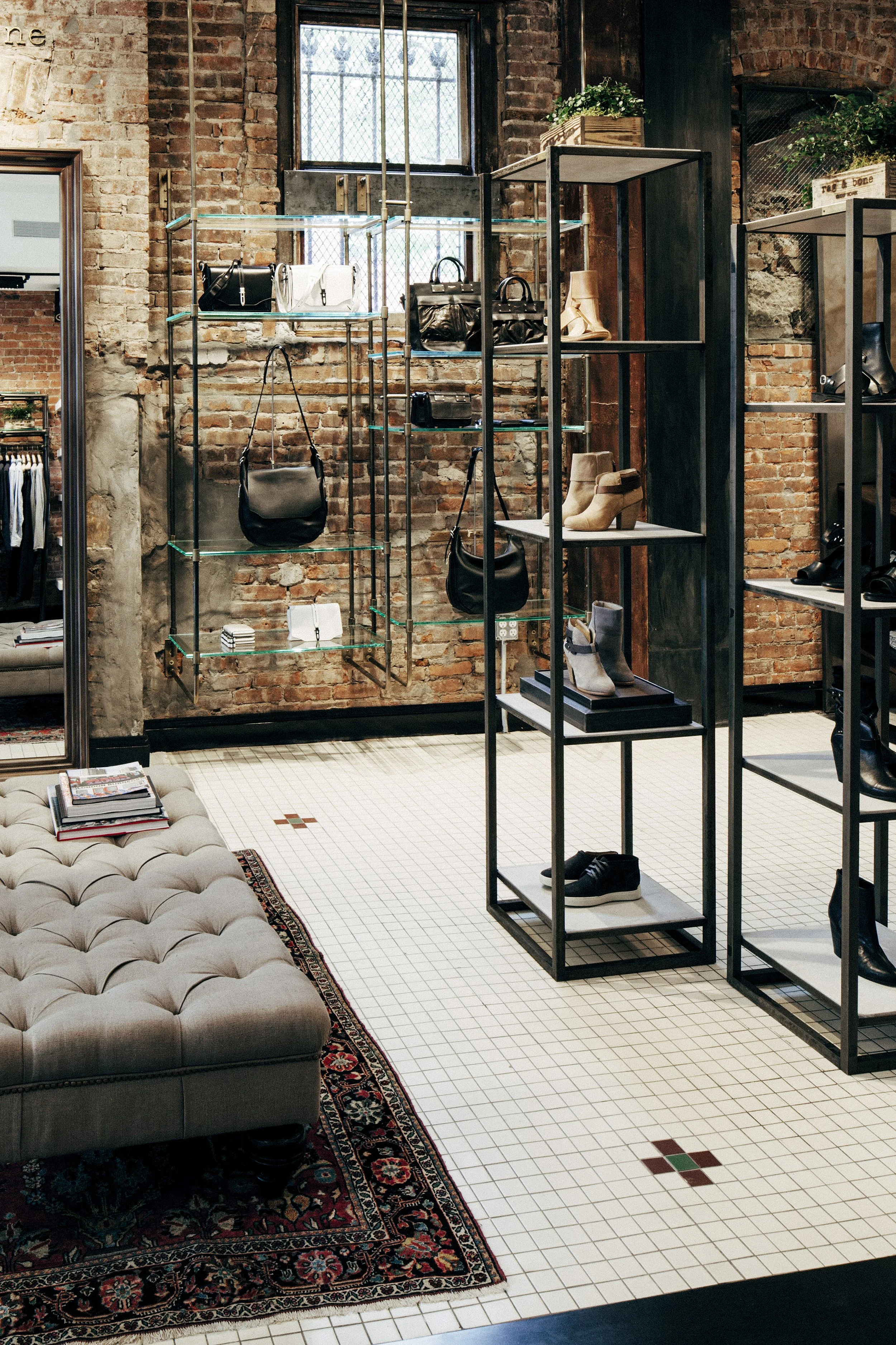 BLD commercial retail adaptive reuse in Brooklyn, New York includes remnets of the former bar, transparent entry creating a welcoming transition from the street, thoughtful zoning for apparel, accessories, and fitting areas