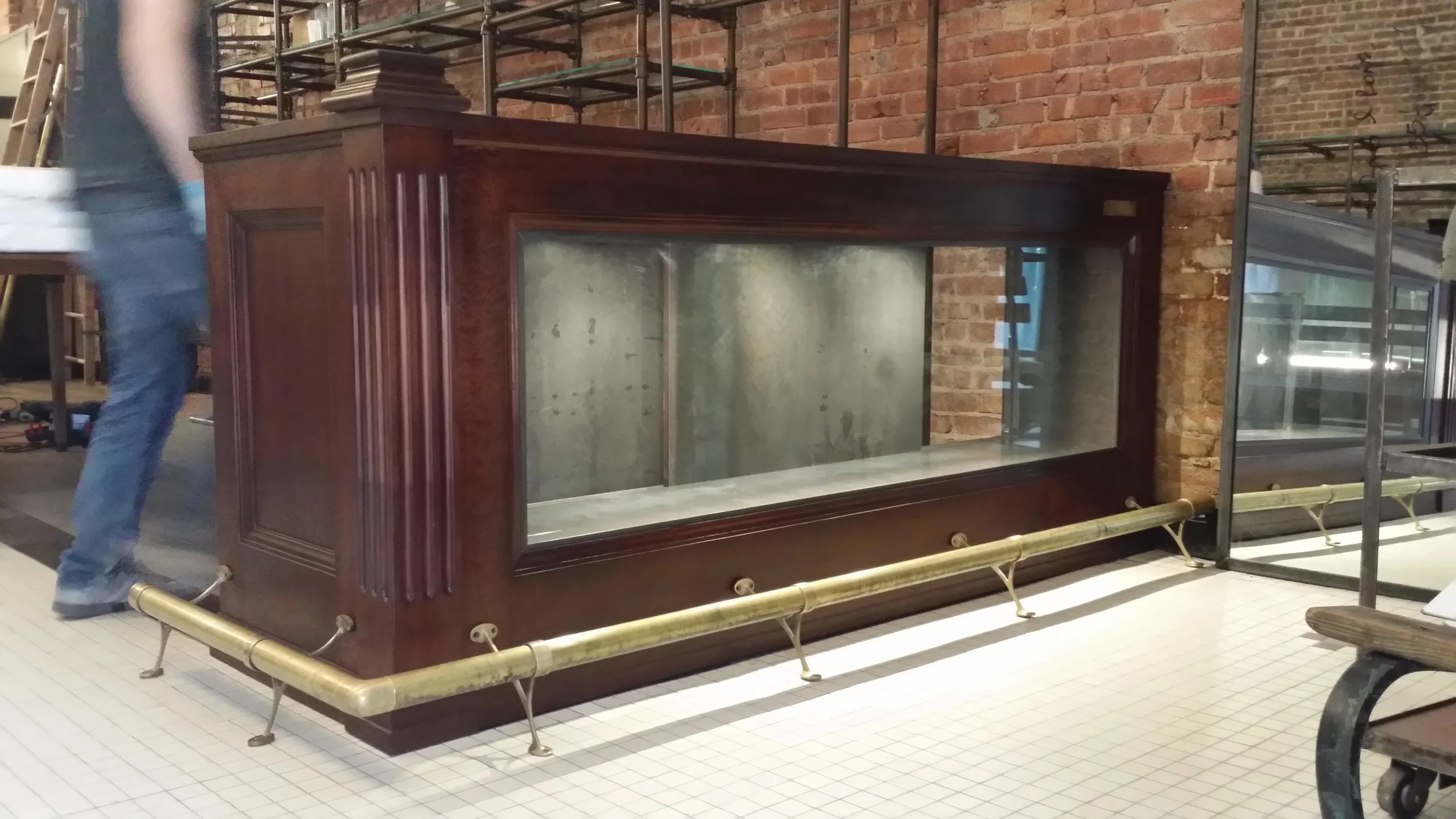Preserved historic wood bar from the original Cobble Hill space incorporated into the Rag & Bone Brooklyn adaptive reuse retail design