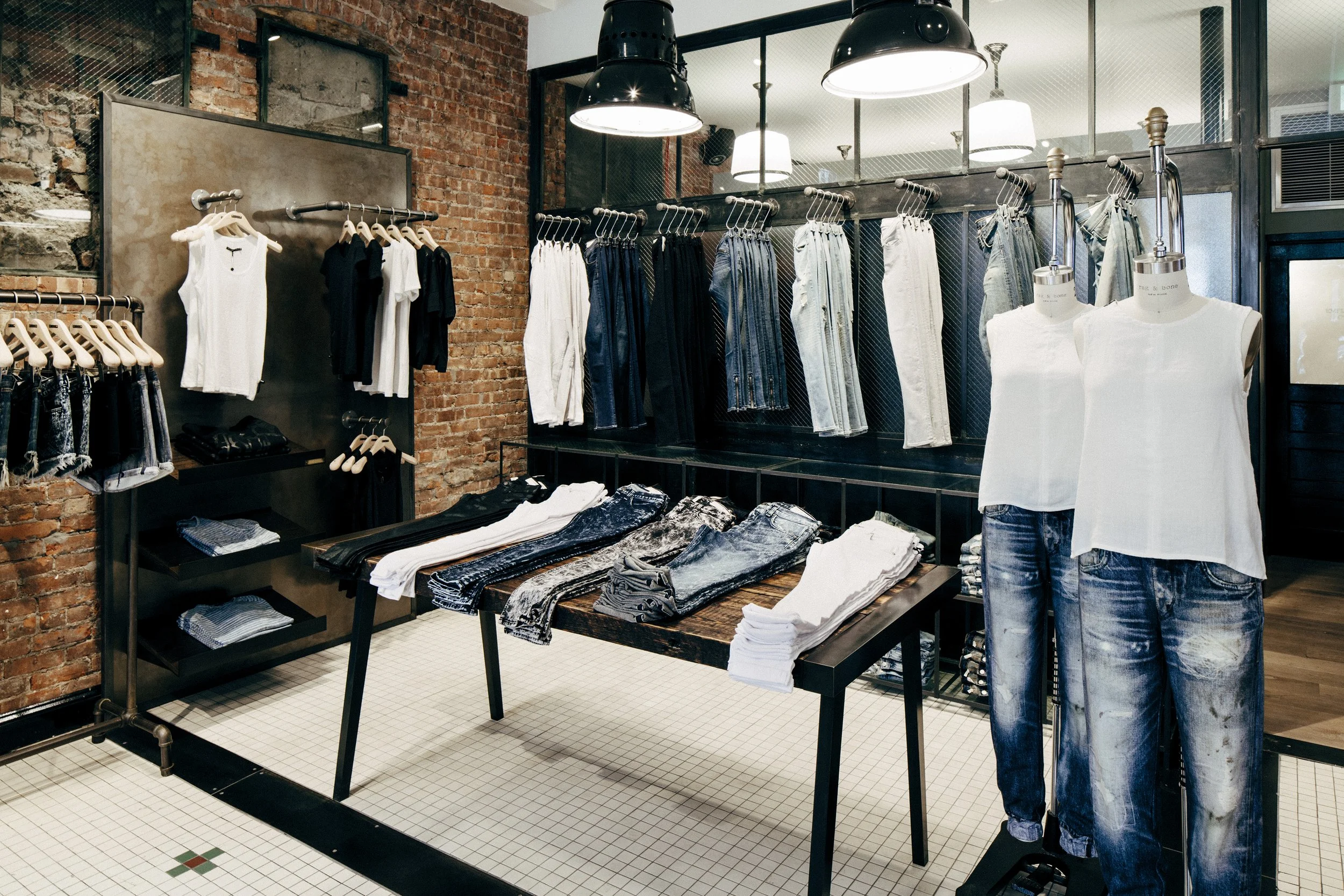 BLD commercial retail adaptive reuse in Brooklyn, New York includes remnets of the former bar, transparent entry creating a welcoming transition from the street, thoughtful zoning for apparel, accessories, and fitting areas