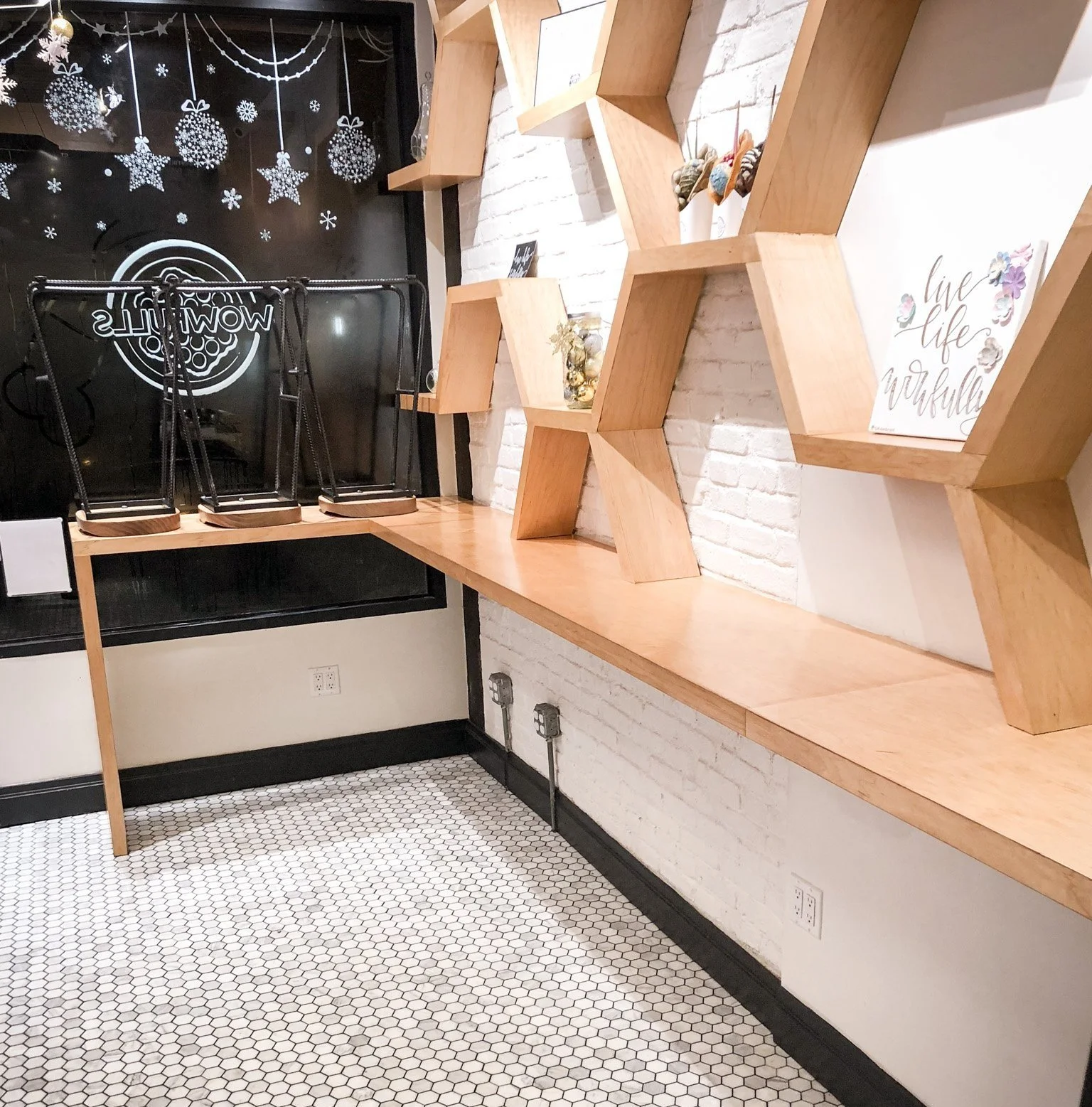 BLD Inc commerical food place in New York, incorporates traditional shape of the original Hong Kong style egg waffles to create functional display shelves, and easy movement for waffle artists