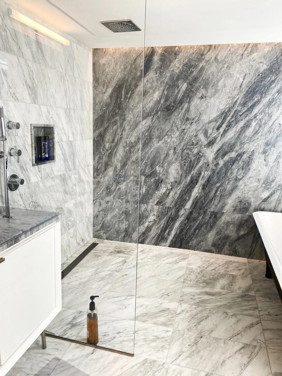 BLD residential rennovation in New York, rennovations included removing partitions, opening up the bed to the closet, sleeping area doubled in space, swing doors converted to black steel-framed glass sliding doors