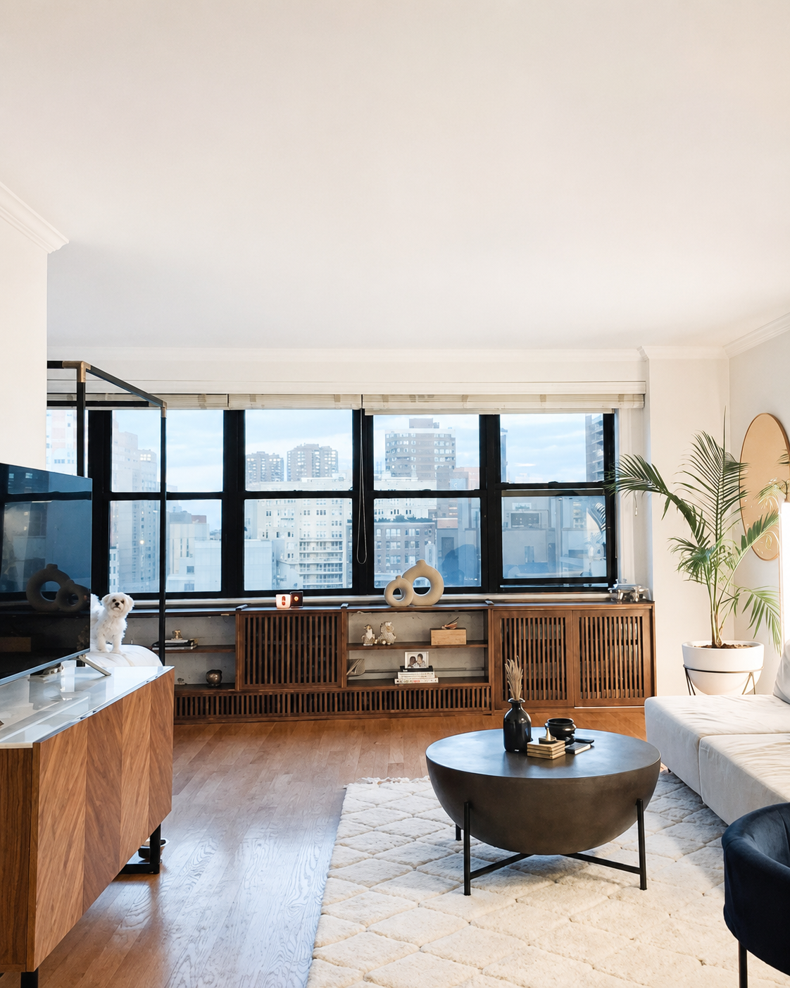 BLD residential rennovation in New York, rennovations included removing partitions, opening up the bed to the closet, sleeping area doubled in space, swing doors converted to black steel-framed glass sliding doors