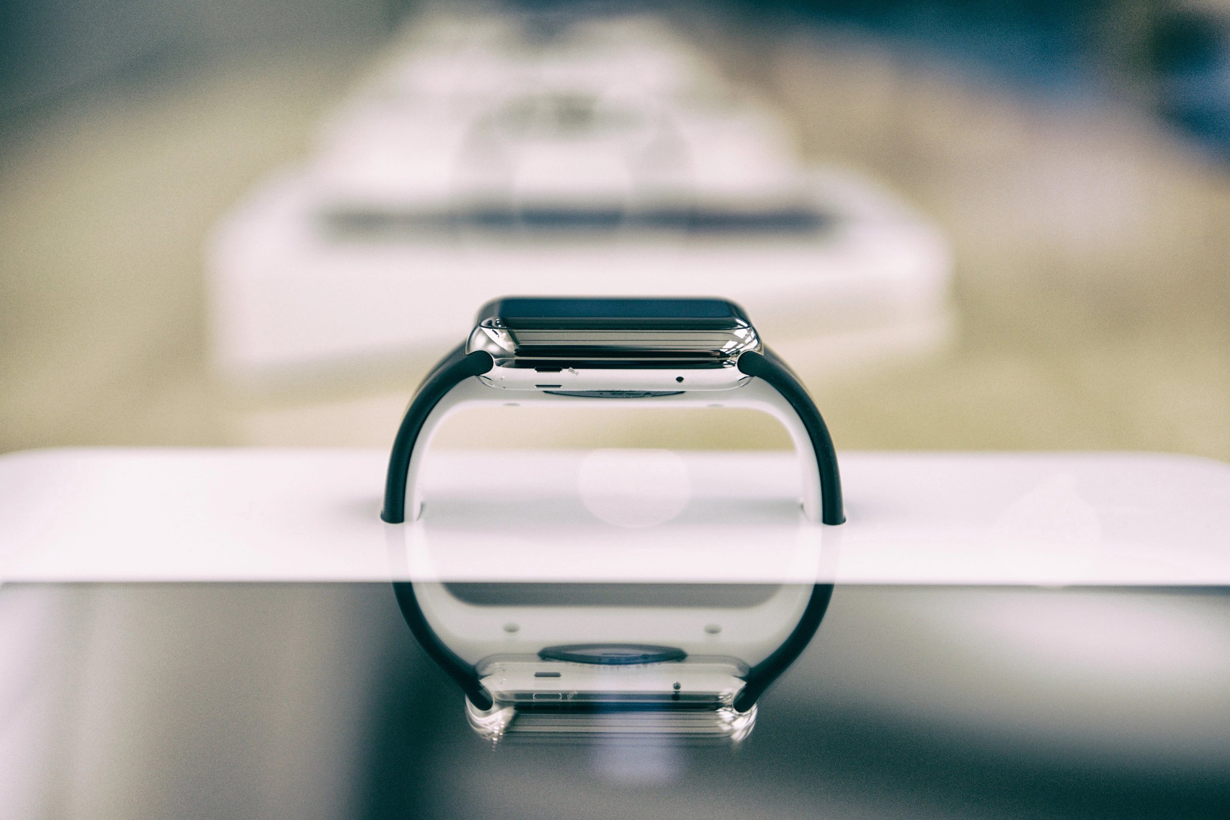 This Smart Display for Apple Stores has a deconstructed iPad and integrated Apple Watch that are connected to each other so that people can interact with the Watch and learn about it.