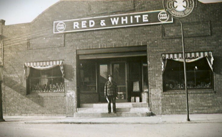 This is the only known photo of a building that stood on Main Street, in the vicinity of the Main Street Farmer restaurant, from about 1920 until 1946. Originally constructed by H.W. Dick for cars sales and mechanic shop, it was purchased by Emil Web