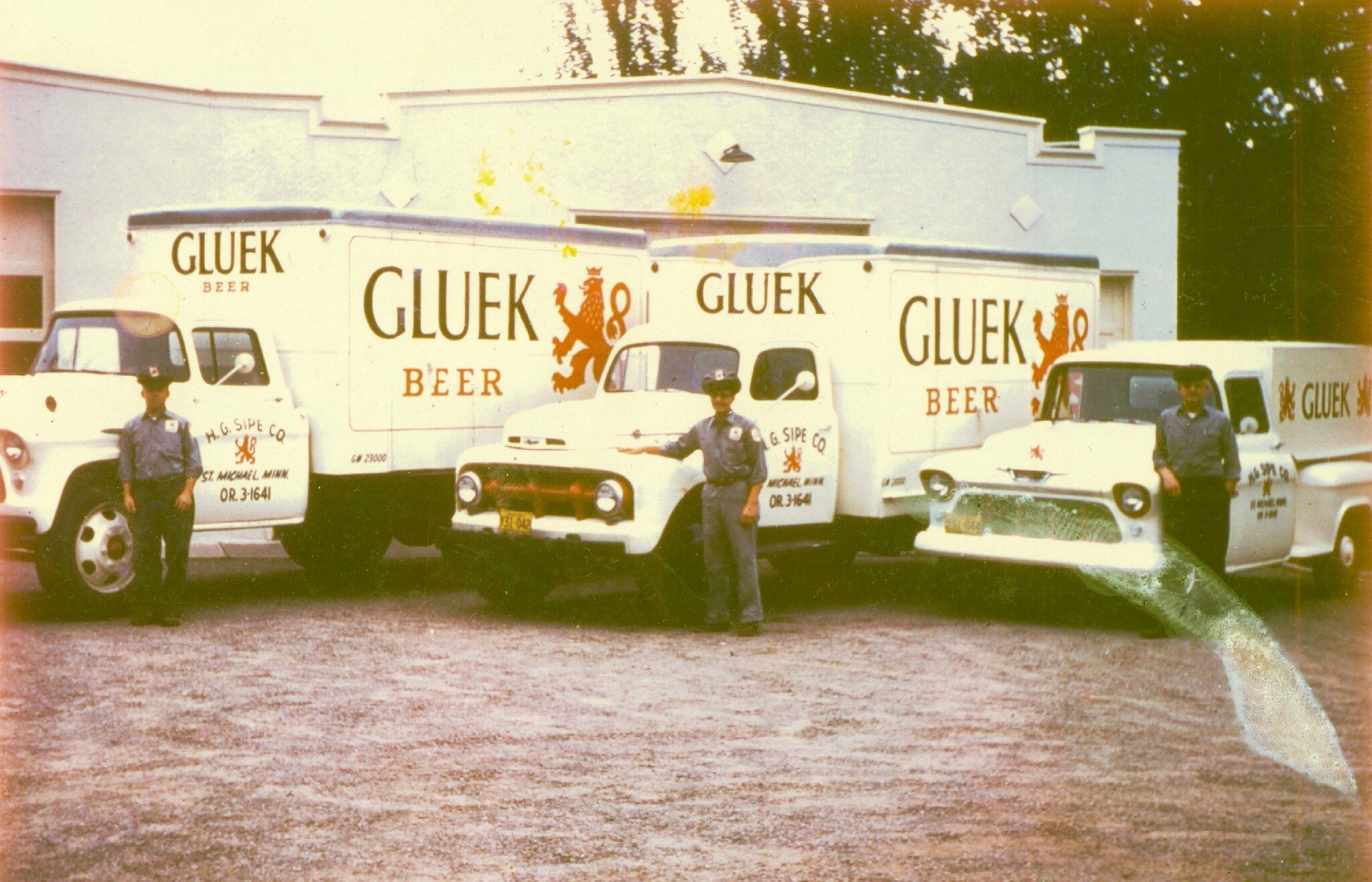 This is no April Fools joke. That building behind the trucks is now Home Grown, the restaurant owned by Ellie and Drew Anderson. This photo from 1956 shows the beer distributorship of Howard Sipe who was the original owner of those buildings. Standin