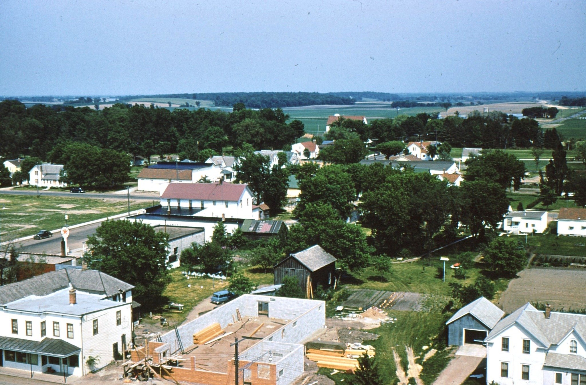 This view of the east side of South Main Street was taken by Frank Zachman in 1955. Frank took this shot from the water tower which stood behind what is now Mainstreet Farmer. Much of what is in the foreground of this photo is now either the Walgreen