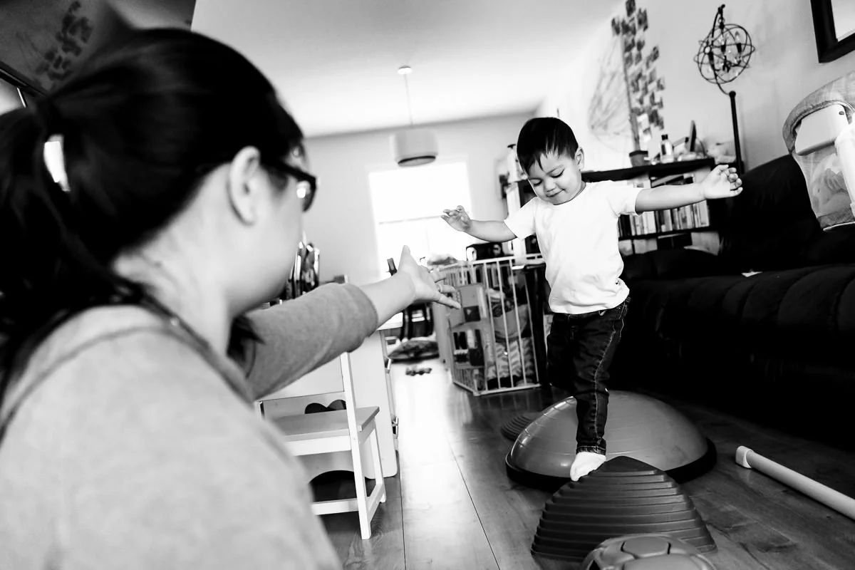 candid-family-photography-calgary-toddler-balancing