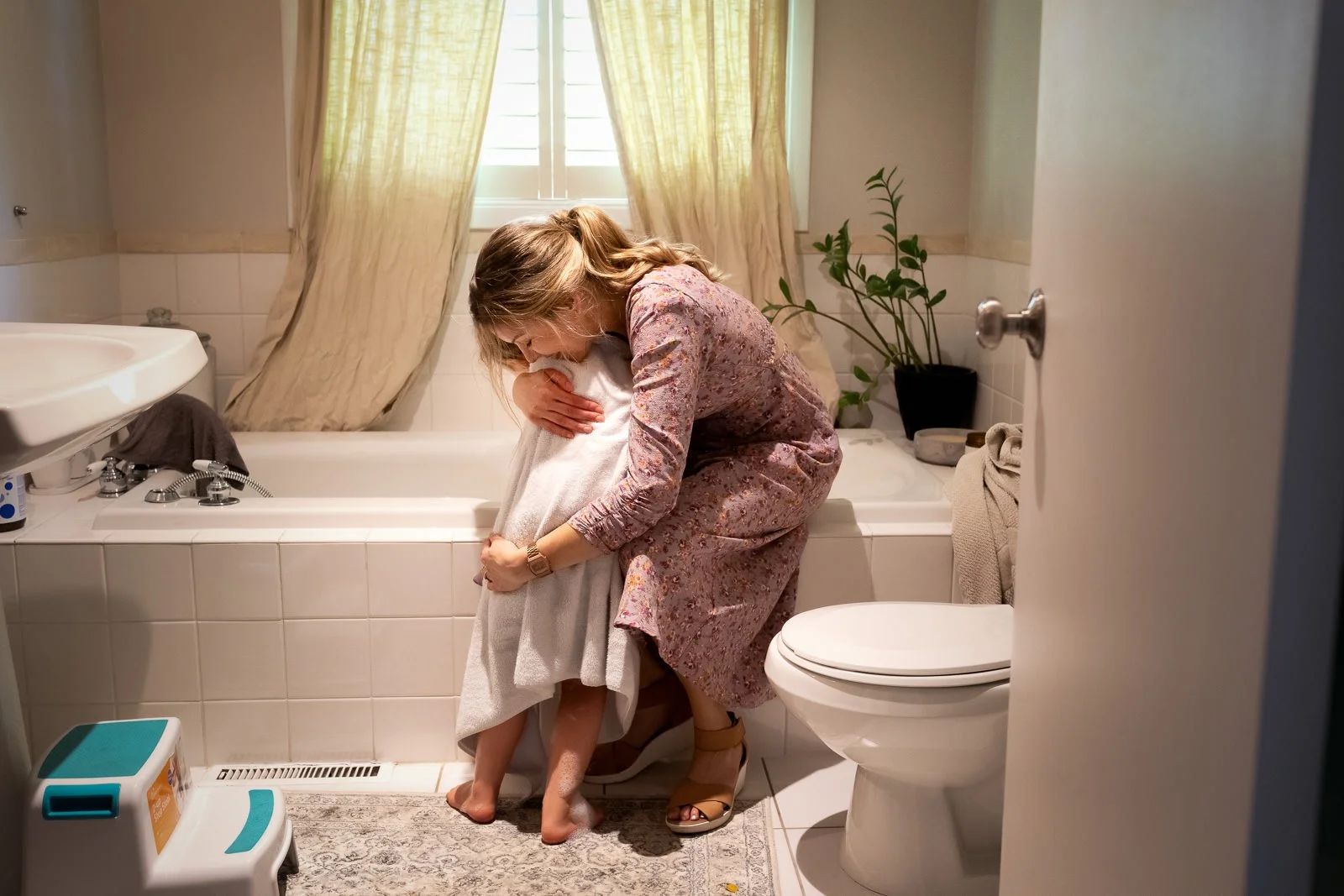 mother close hug bath towel