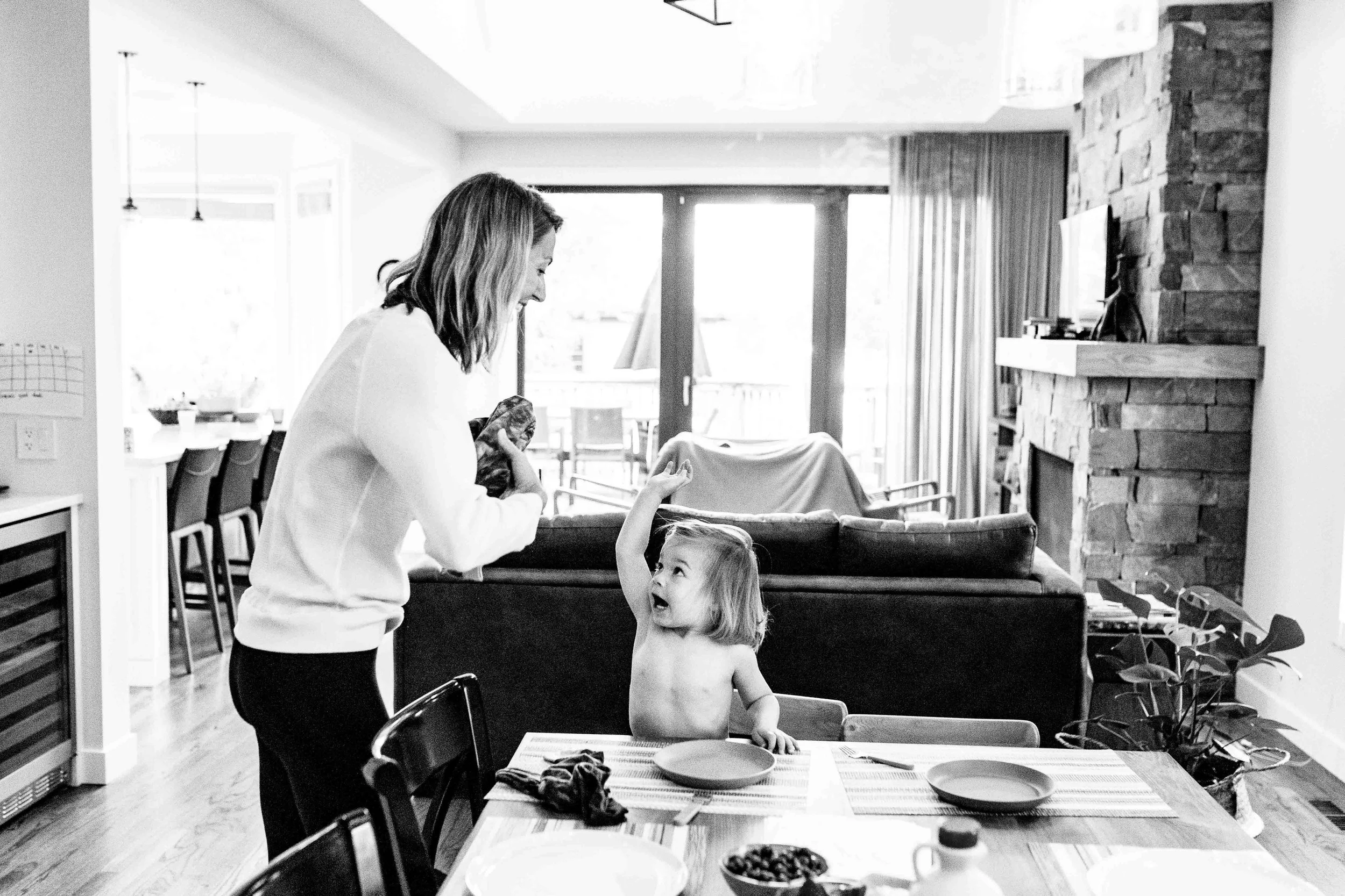 mother and daughter moment at kitchen table