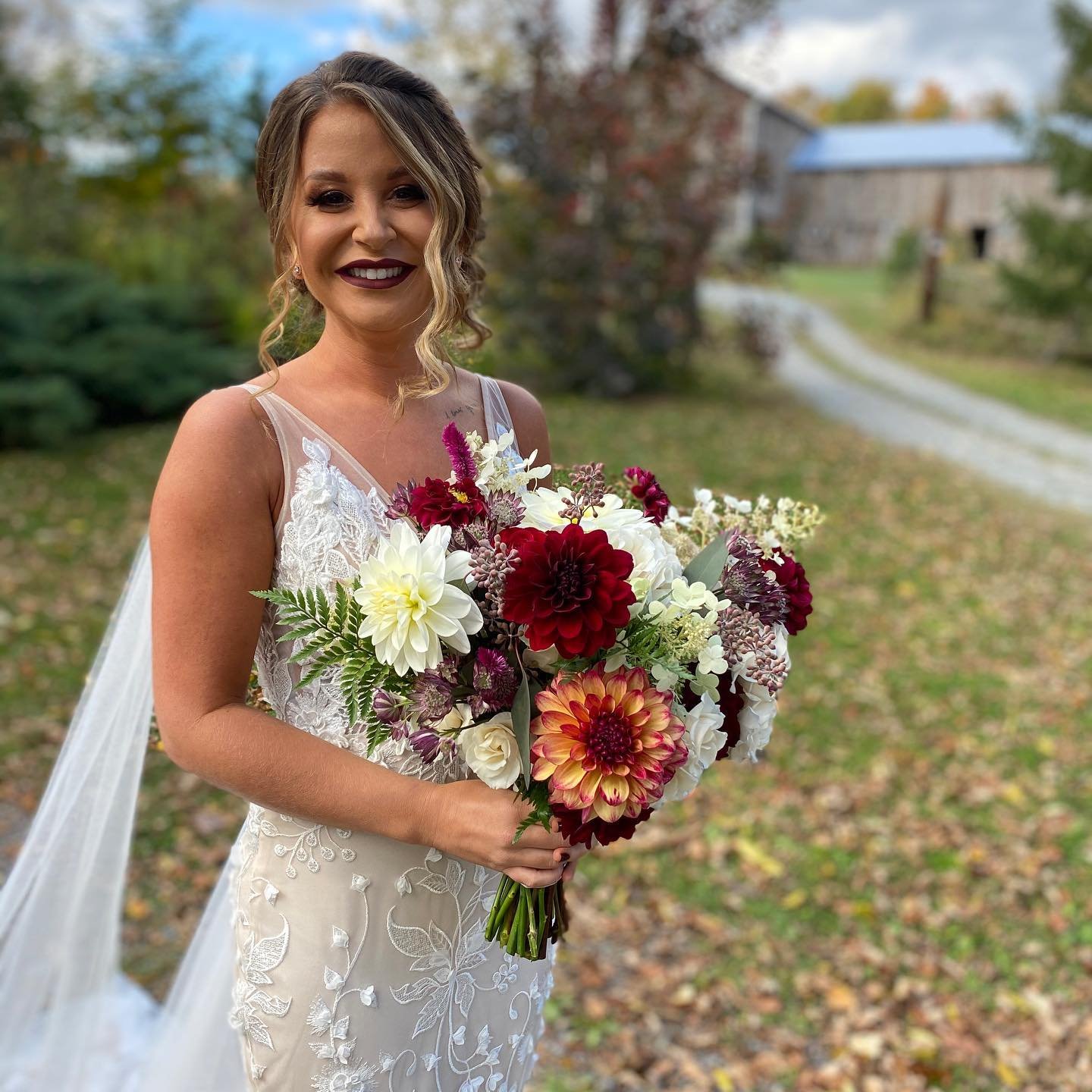 Bride with Flowers at Fox Hill Farm in Honesdale PA.jpg