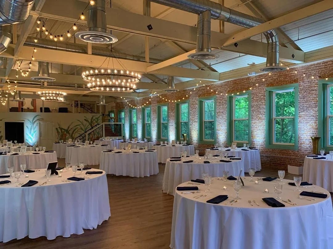 Round tables set for a party at 6th & River warehouse space in Honesdale, PA.
