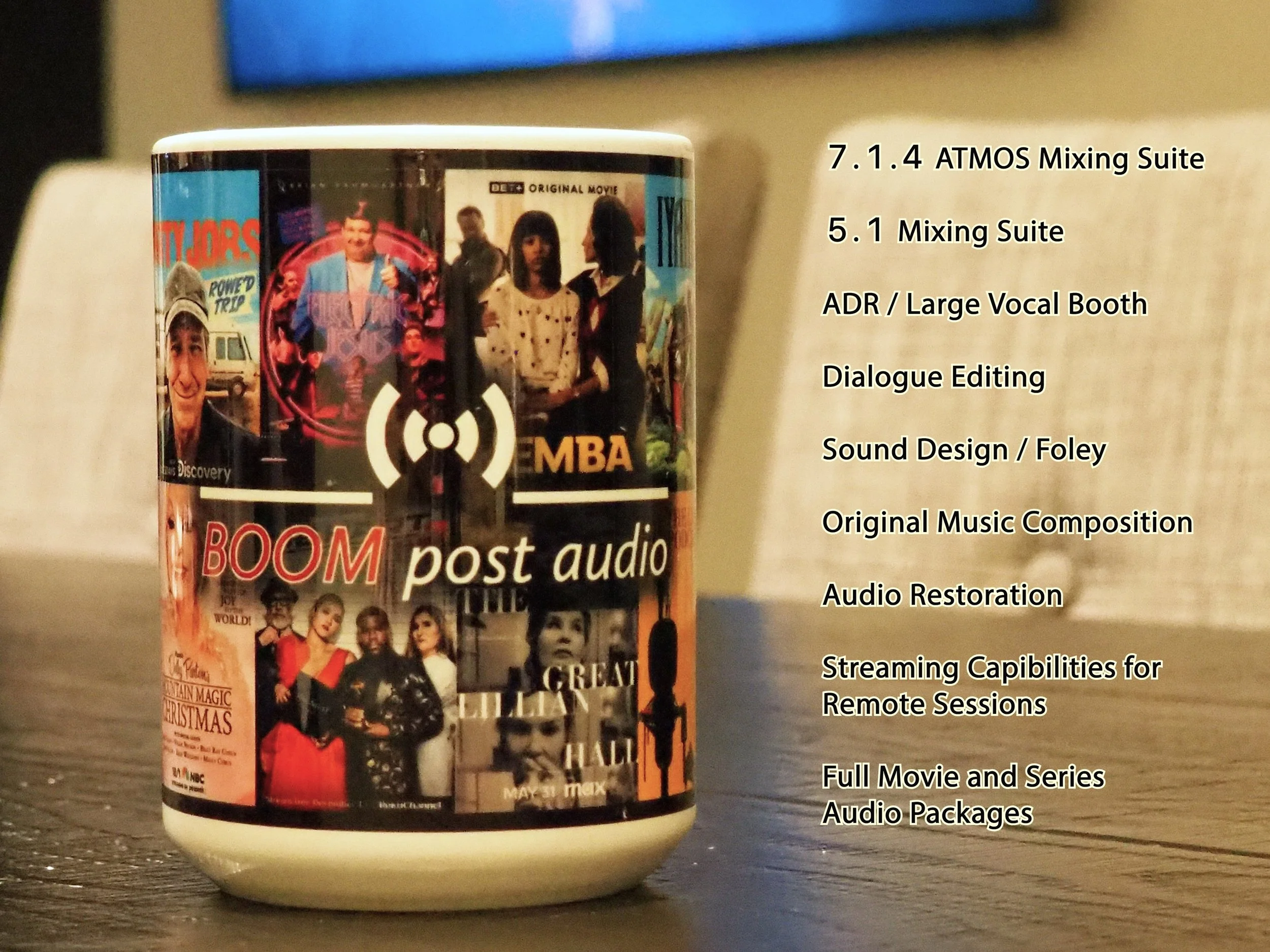 A mug with a collage of various TV and movie show posters, placed on a wooden table, with a list of technical audio post-production skills and services written on the right side.