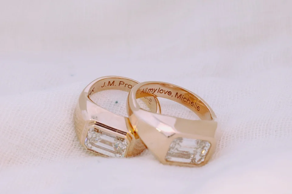 Gypsy Set Signet Ring Solitaire with east west emerald cut diamonds in yellow gold and engraving on inside of ring