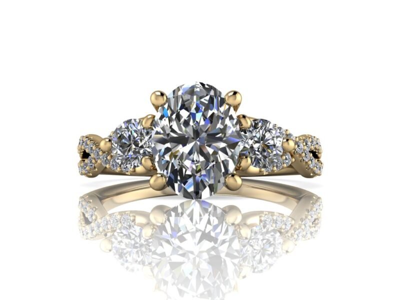 14k yellow gold 3 stone engagement ring with twist band. Oval Forever One moissanite center with round side stones and natural melee diamonds on the twist band