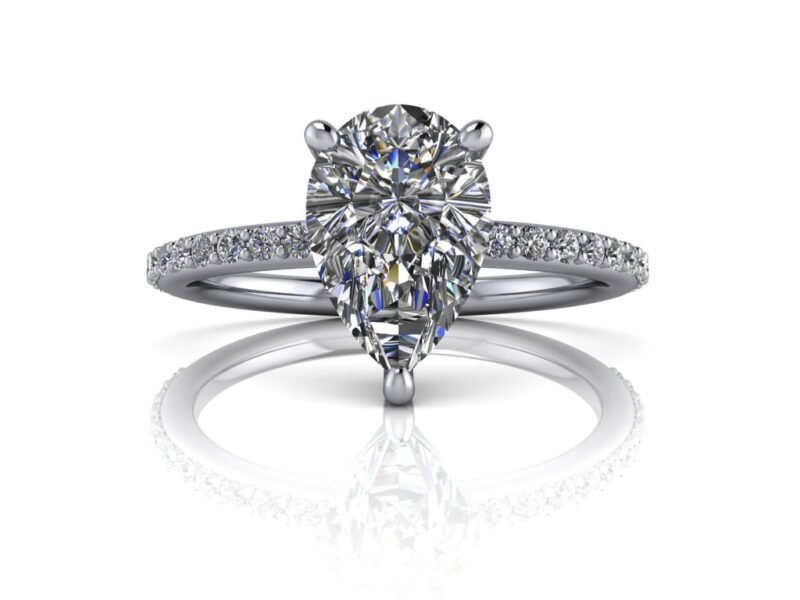 14k white gold engagement ring with a pear cut center in a basket setting with diamond accents along the band.
