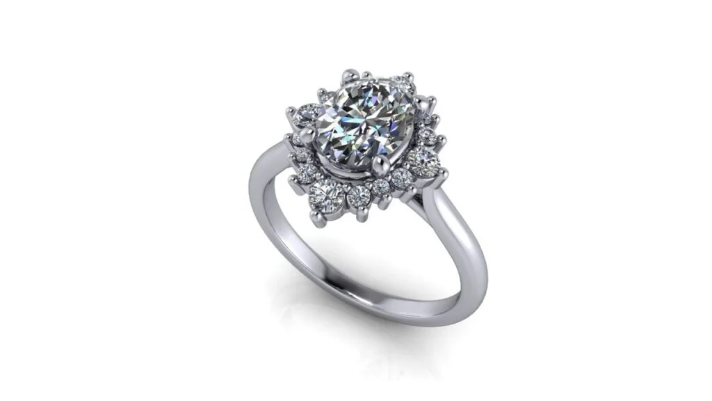 14k white gold engagement ring with oval center stone and starburst style diamond accent halo.