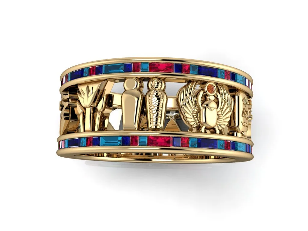Traditional Egyptian motifs ring with rubies and emeralds in yellow gold, band with mummies, sphinx, ankh, Horus, eye of Horus, scarab beetle, and pyramids of giza.