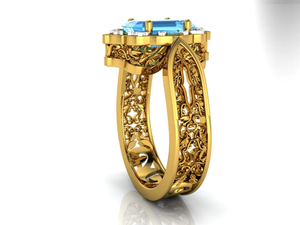 Persian Carpet Inspired ring with swiss blue topaz emerald cut center stone and intricate filigree on halo and down side of ring in yellow gold
