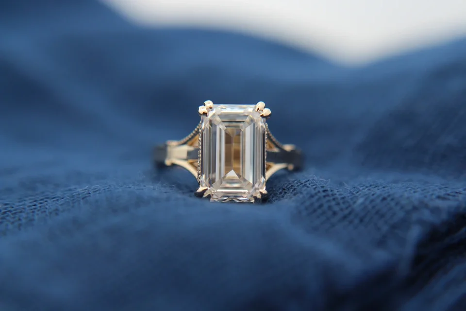 Emerald Cut Split Shank Wedding Ring with milgrain in yellow gold