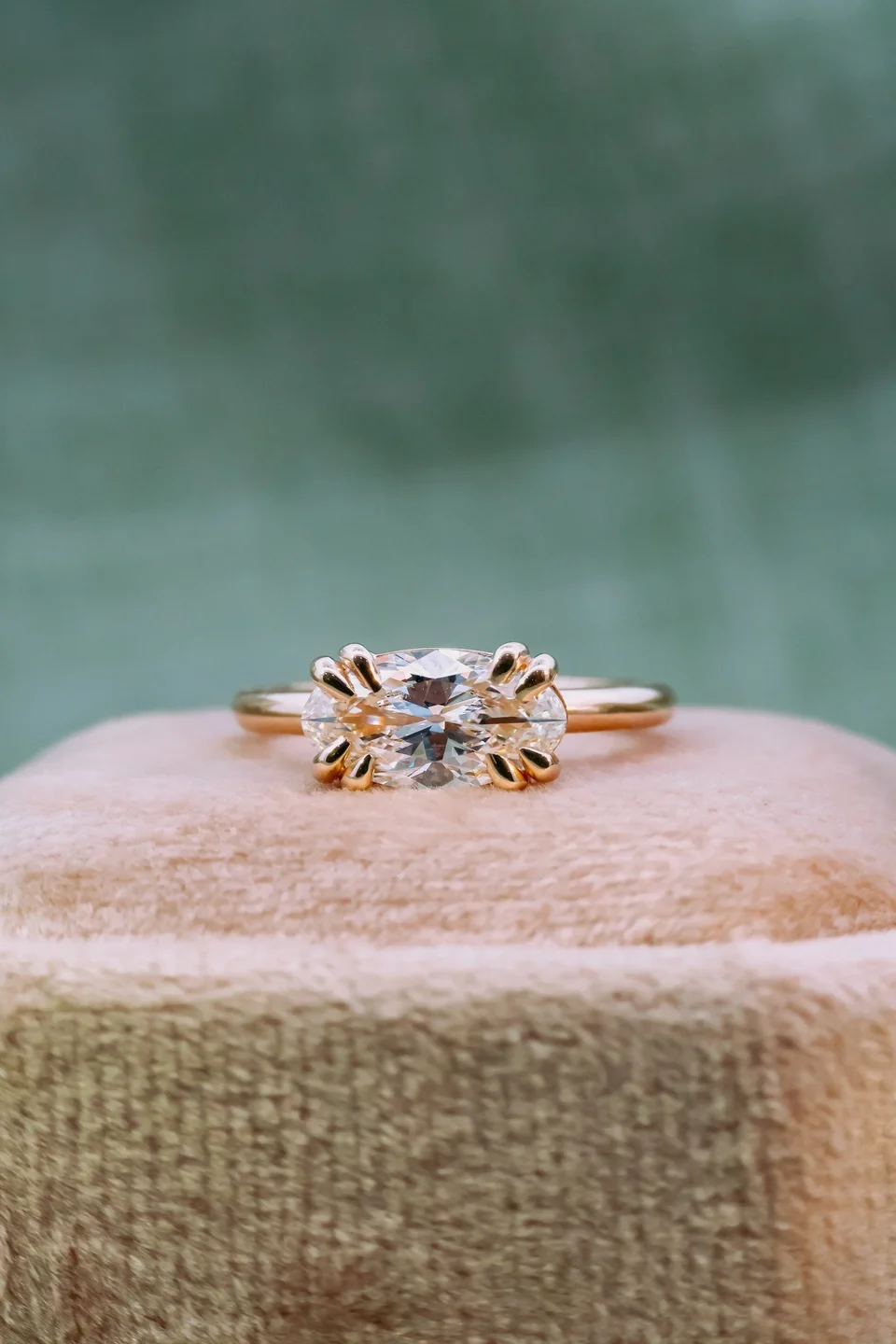 East West Setting Elongated Oval Ring with double prongs in yellow gold