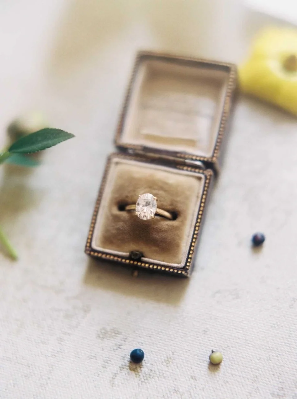 Oval diamond yellow gold solitaire in brown box
