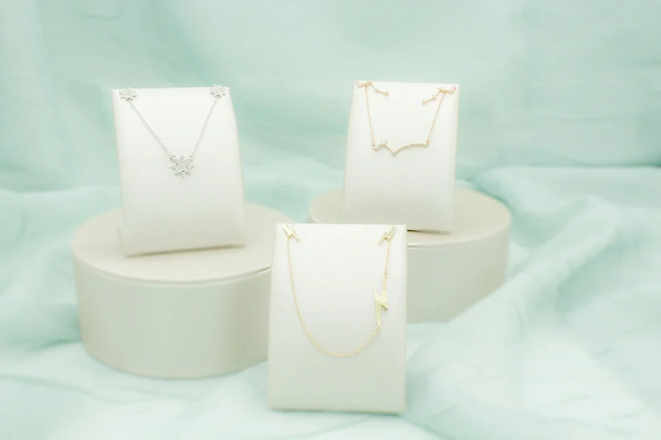 Lightning bolt necklace and earrings matching set in yellow gold, white gold snowflake necklace and earrings matching set, rose gold constellation necklace with earring climbers matching set