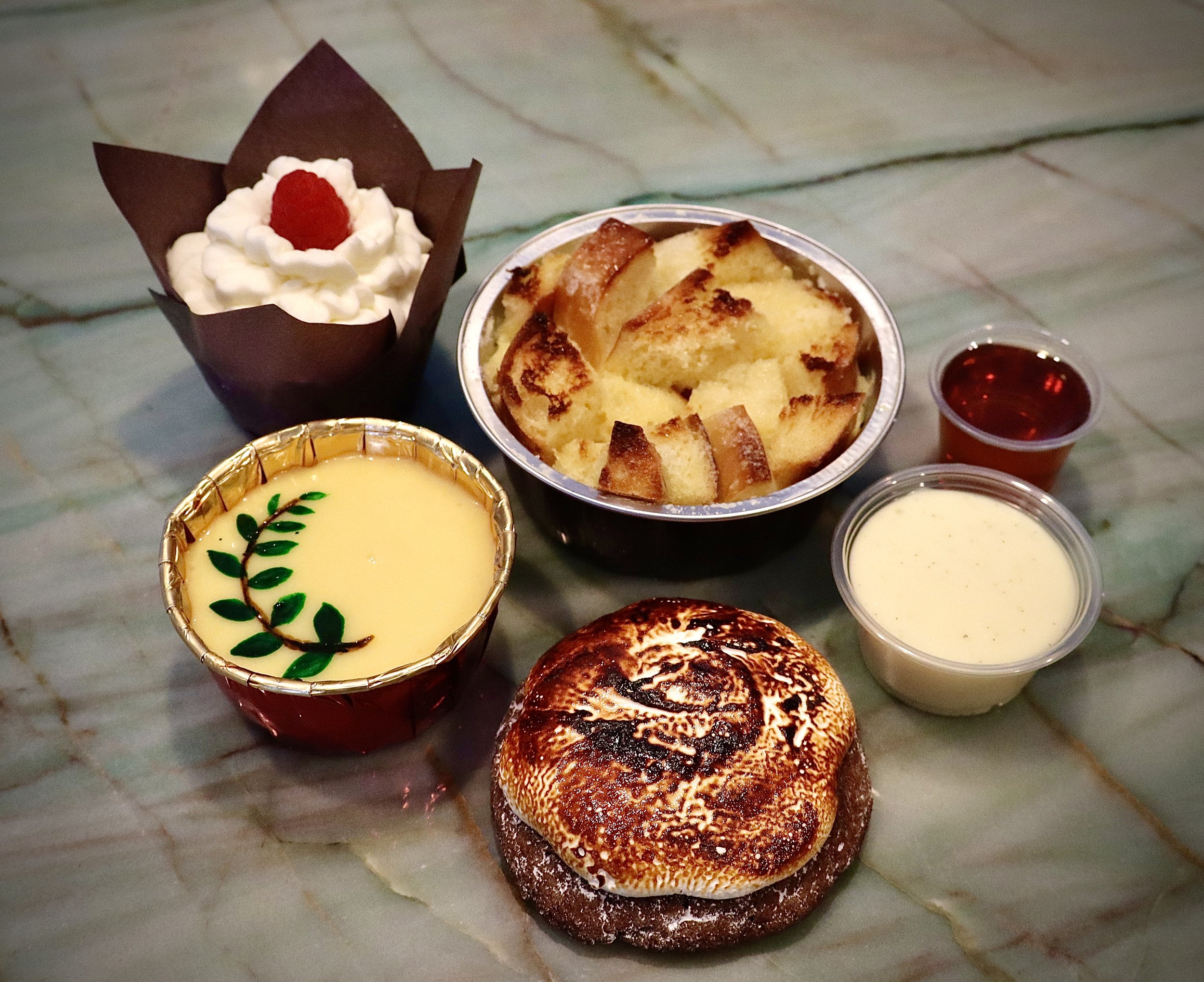 Lemon Raspberry Cupcake (top left)
Sourdough Bread Pudding with Vanilla Bean Pastry Cream and Rosemary Maple Syrup (top right)
Passionfruit Honey Thyme Cheesecake (bottom left)
Peanut Butter S'mores Cookie (bottom right)