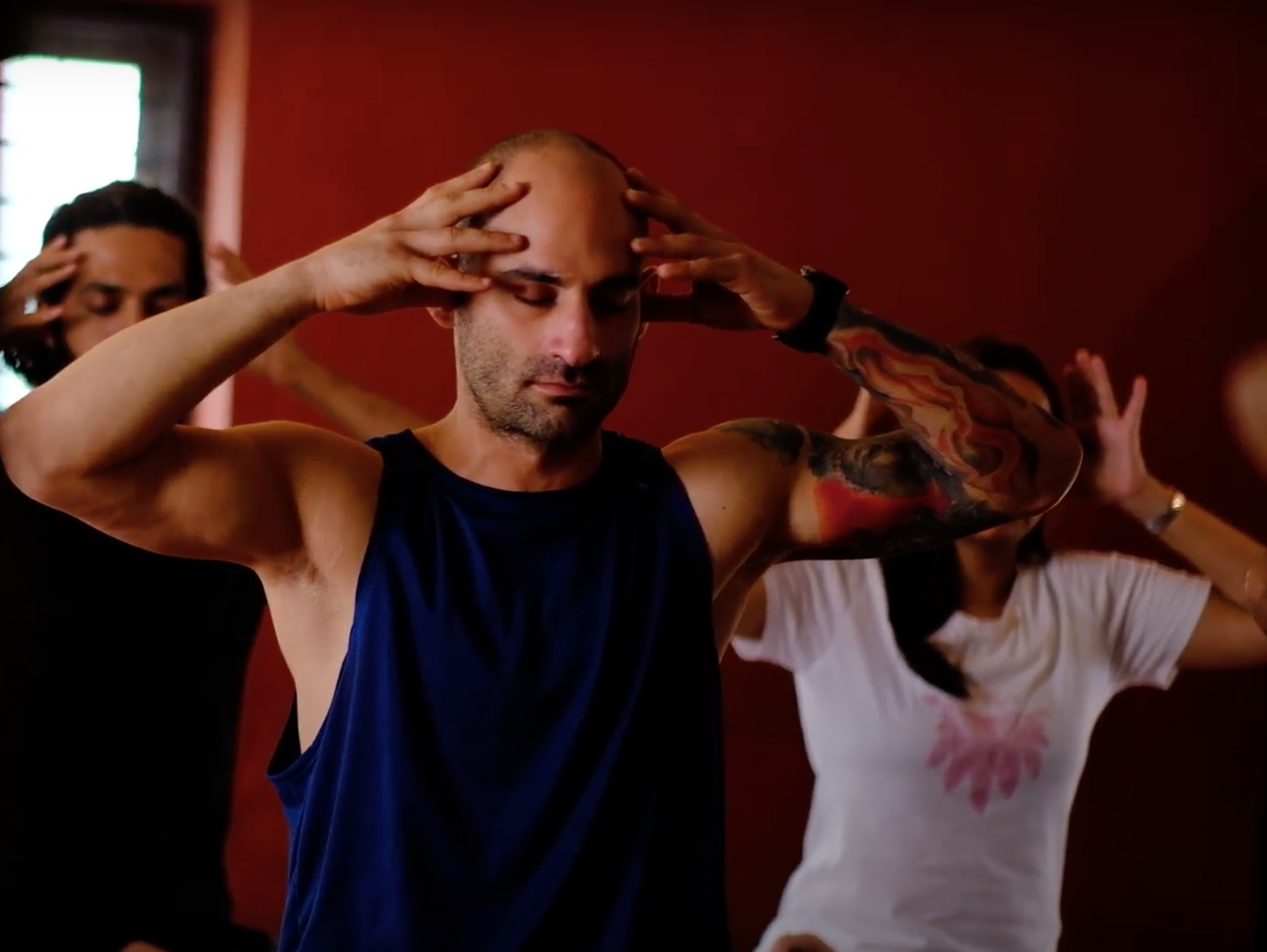 Participants practising a guided yogic techniques at a Yukah programme.