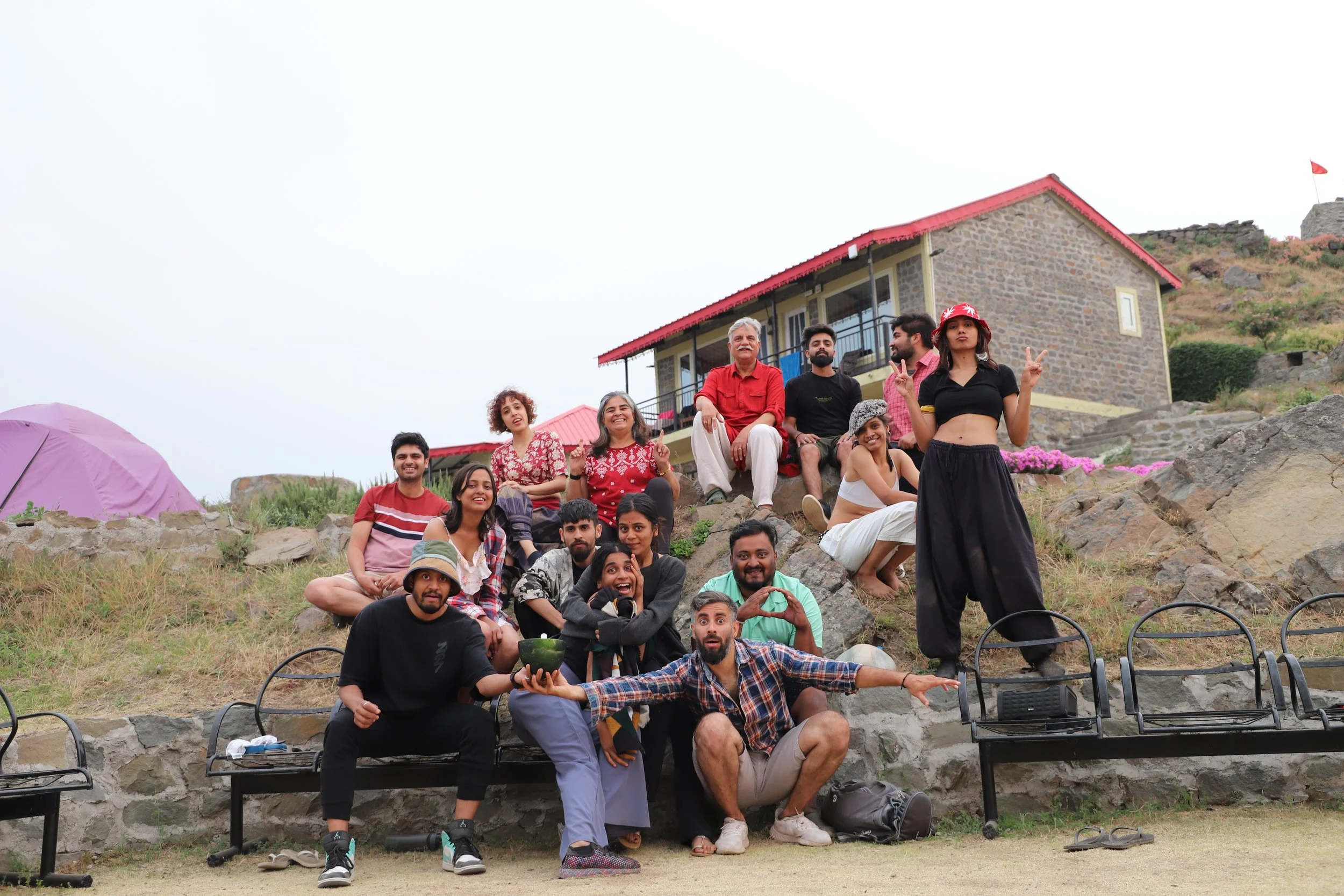 Participants and teachers in a group photo on a hilltop at a Yukah workshop.