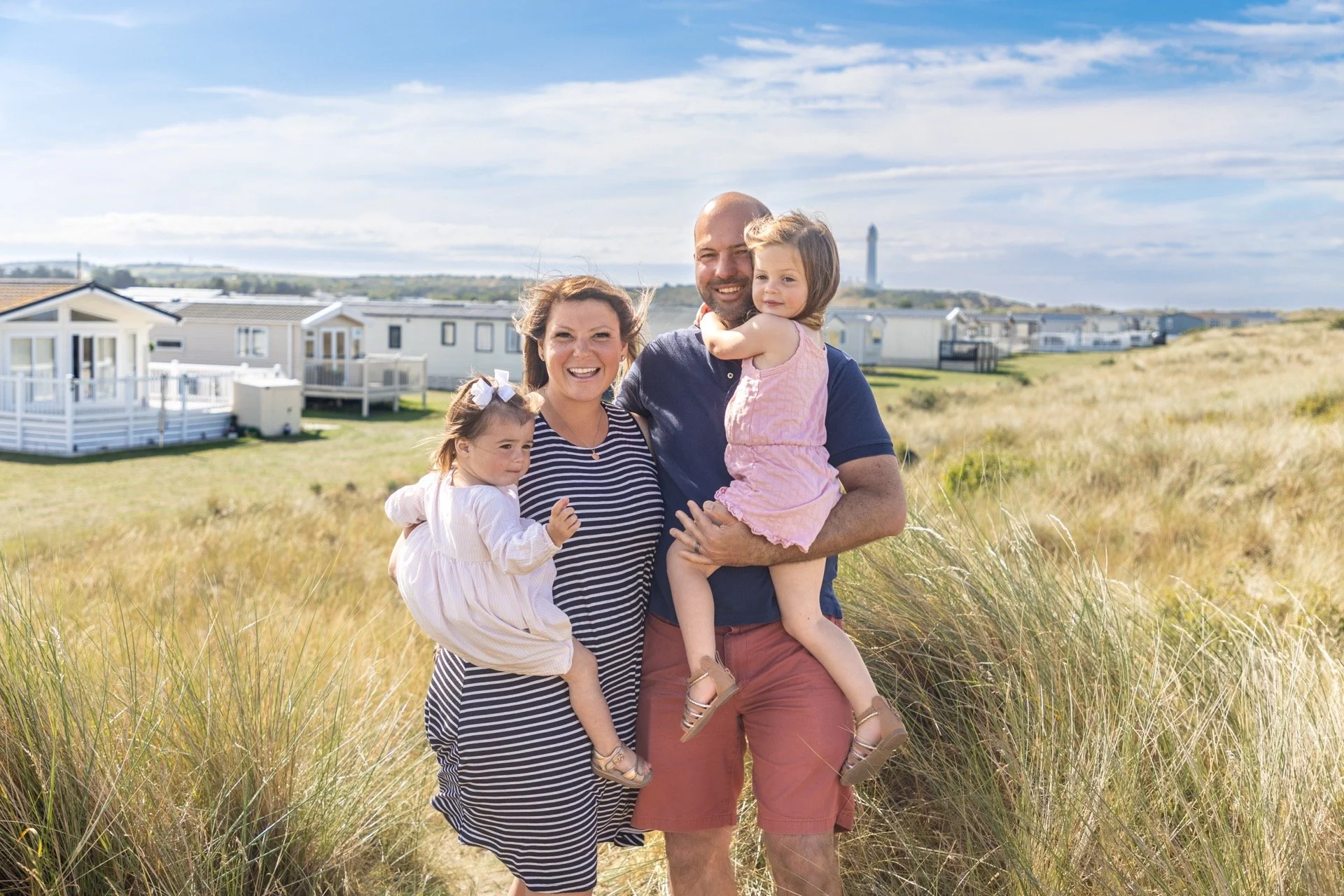 silver-sands-holiday-park-viewpoint-family-with-caravans-and-grass behind.jpg