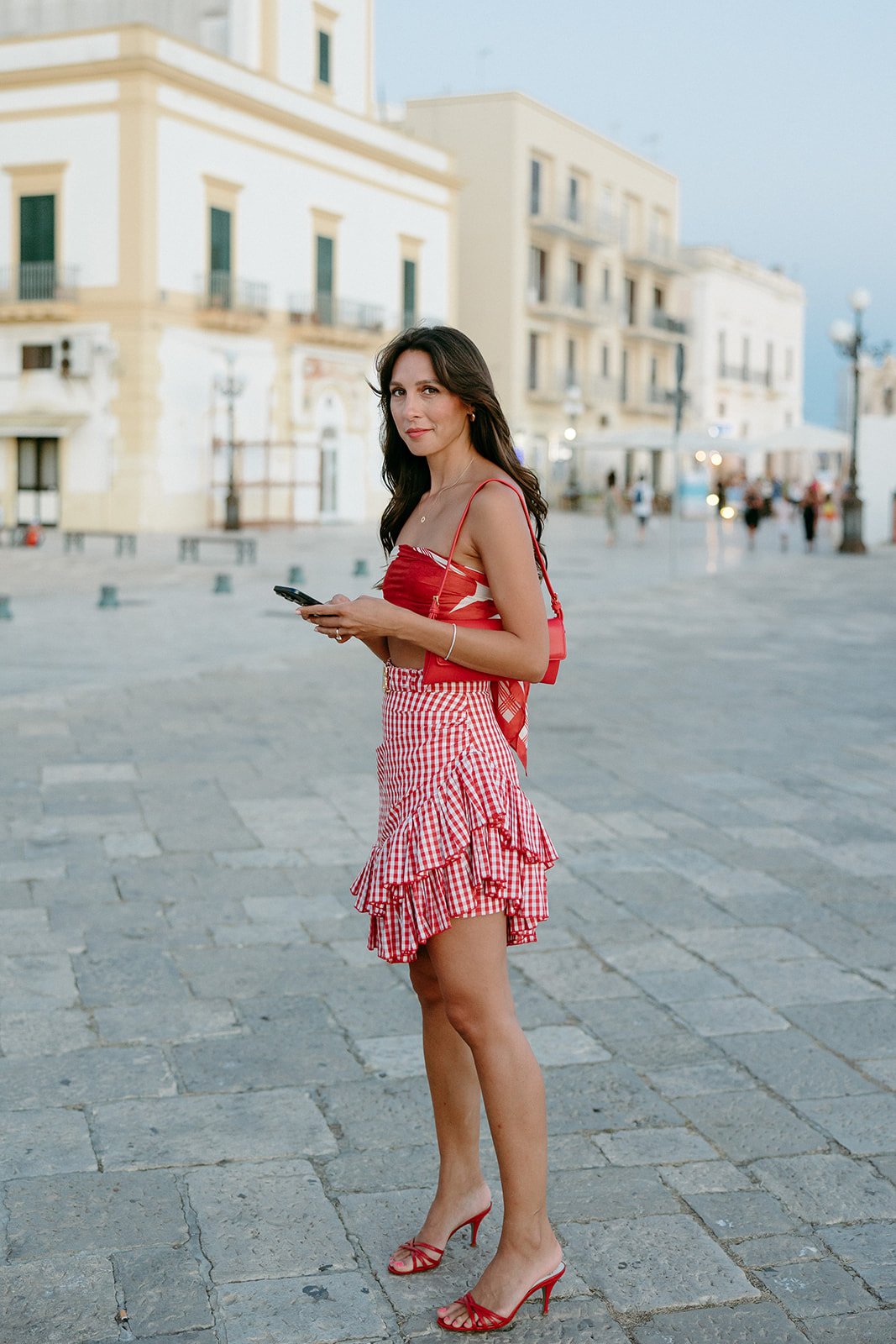 Bride in red in town square for night out in Italy.jpg