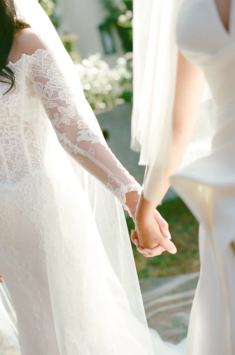 bridesholdinghandsonweddingday.webp
