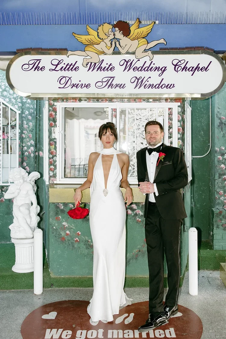couple at the tunnel of love elopement the little white wedding chapel.webp